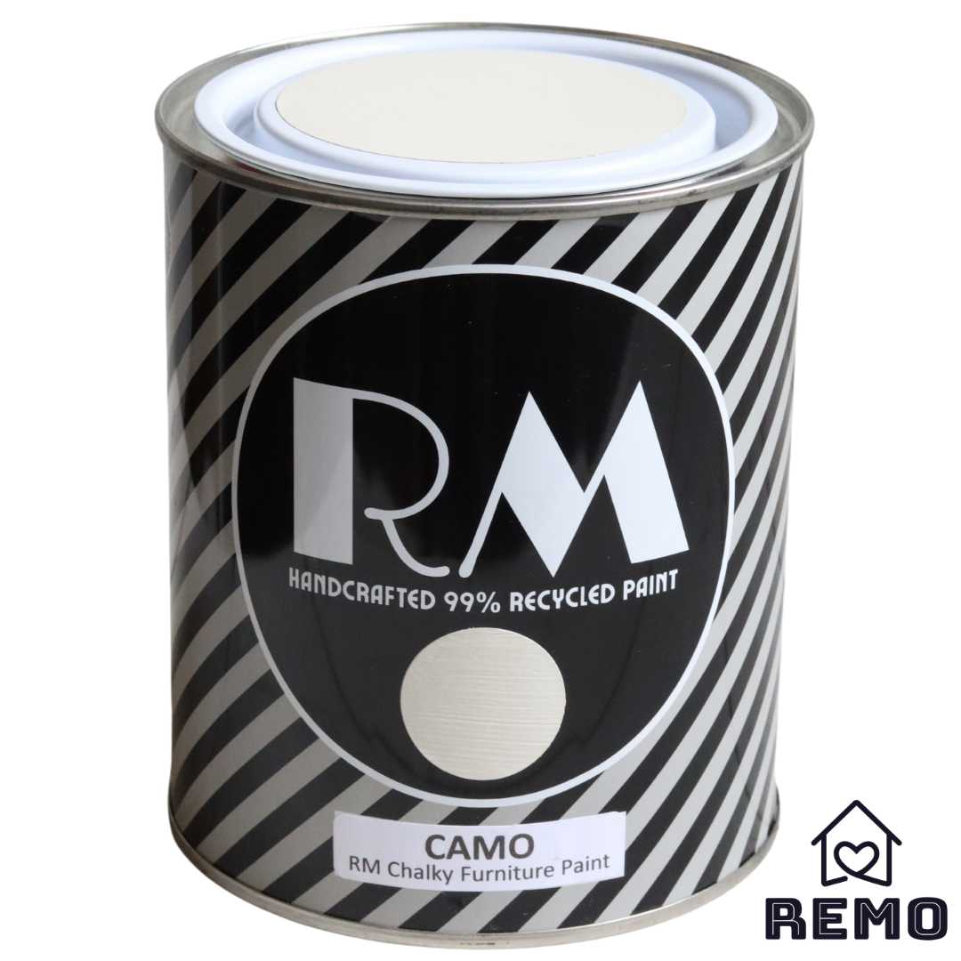 Front angle view of a black white and grey striped tin with round circle paint swatches in the colour Camo which is our lightest colour before china it has a slight brown hue to it.