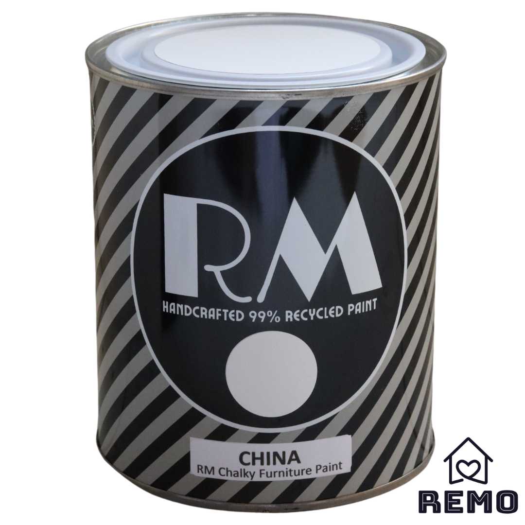 Front angle view of a black white and grey striped tin with round circle paint swatches in the colour CHINA which is the name of our white.