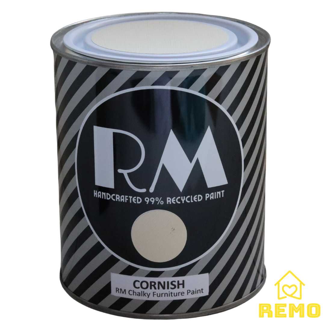 Front angle view of a black white and grey striped tin with round circle paint swatches in the colour CORNISH which is a creamy pale yellow.