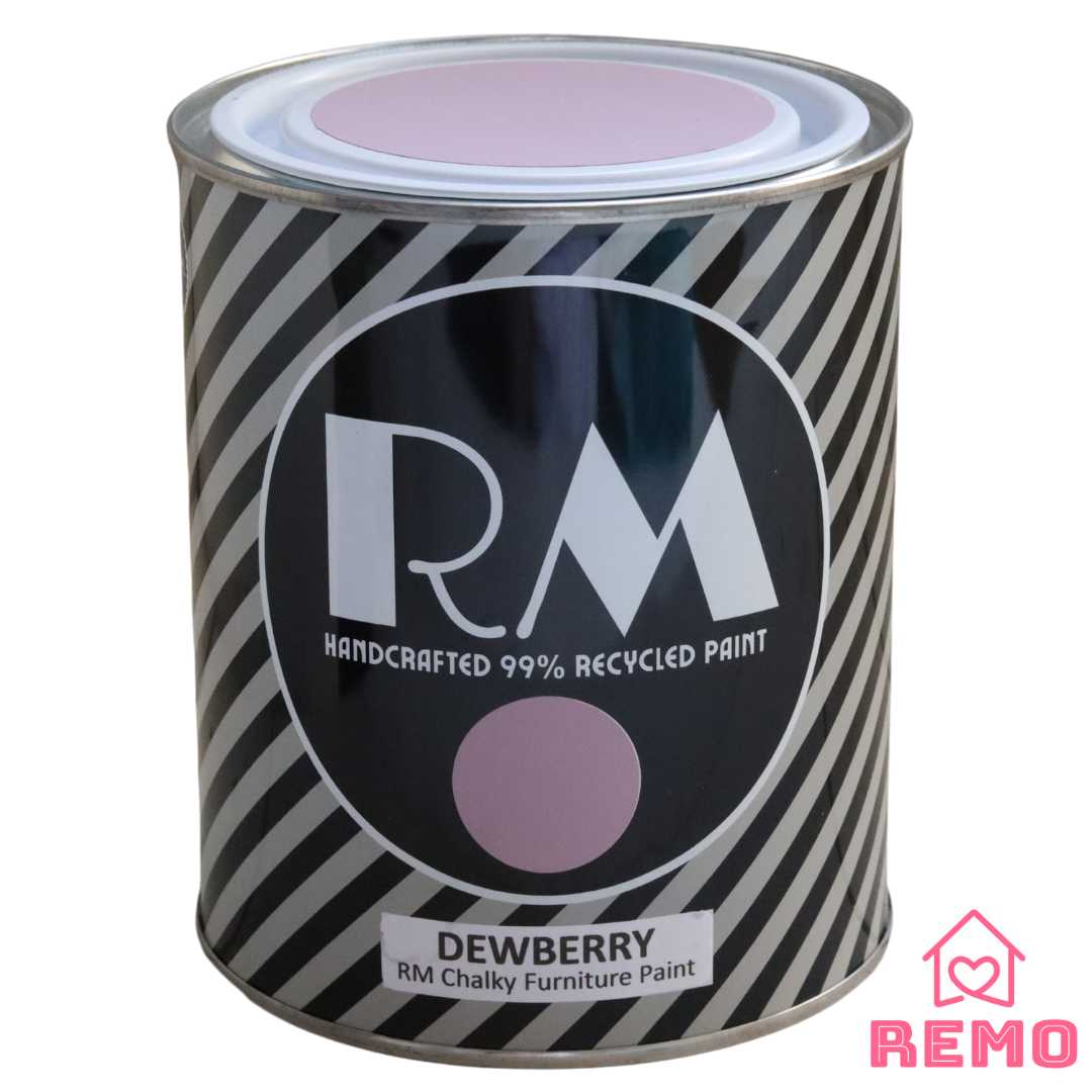 An angled view of an RM paint tins showing the name Dewberry and painted round stickers on the front and the top of the tin.