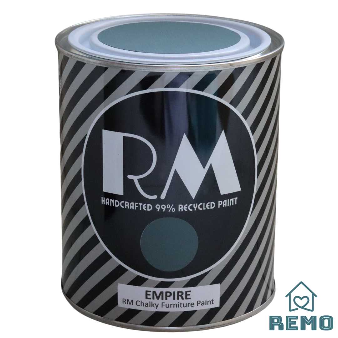 Front angle view of a black white and grey striped tin with round circle paint swatches in the colour Empire a very dark moody green.