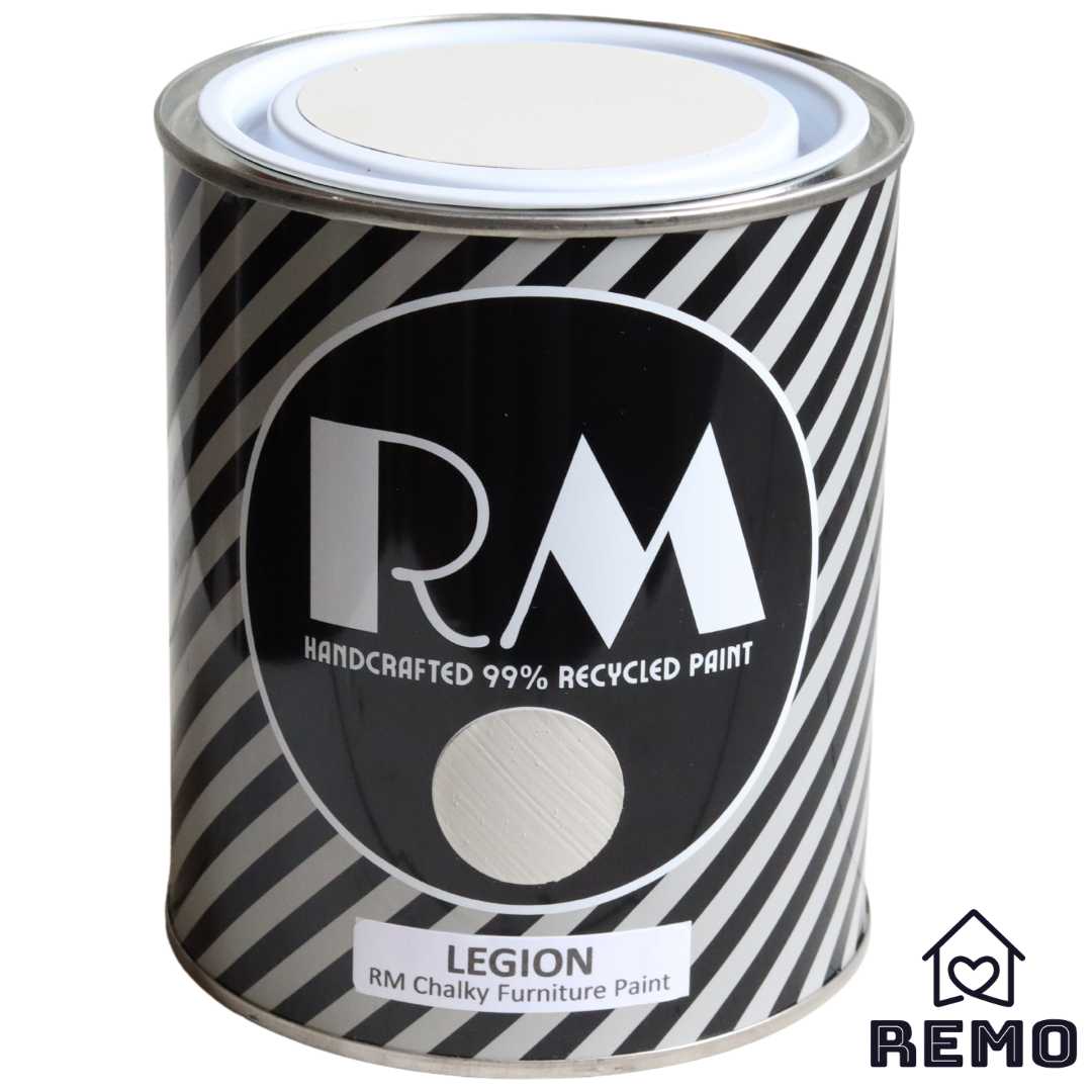 Front angle view of a black white and grey striped tin with round circle paint swatches in the colour Legion it is a weaker colour with a brownish hue.