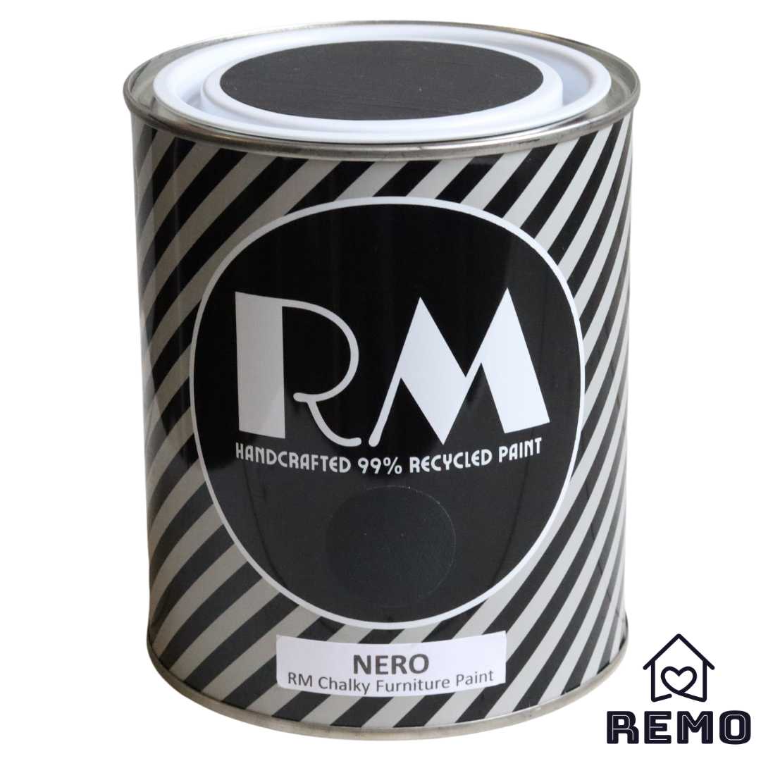 Front angle view of a black white and grey striped tin with round circle paint swatches in the colour Nero this is our darkest colour as it's black.
