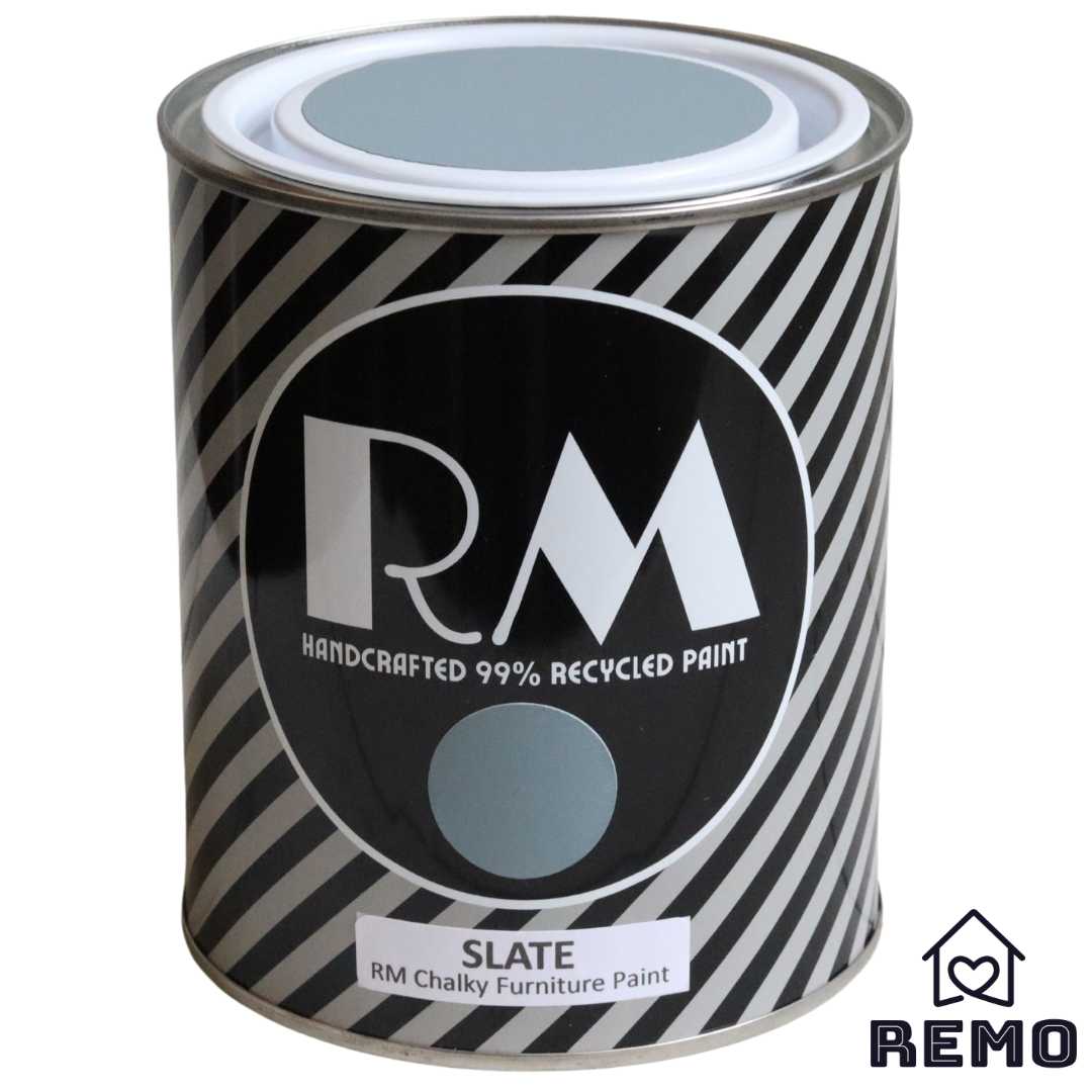 Front angle view of a black white and grey striped tin with round circle paint swatches in the colour Slate it is a grey with a blue hue to it.