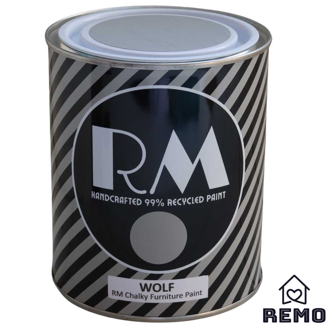 Front angle view of a black white and grey striped tin with round circle paint swatches in the colour WOLF is a grey with a brownish tone to it.