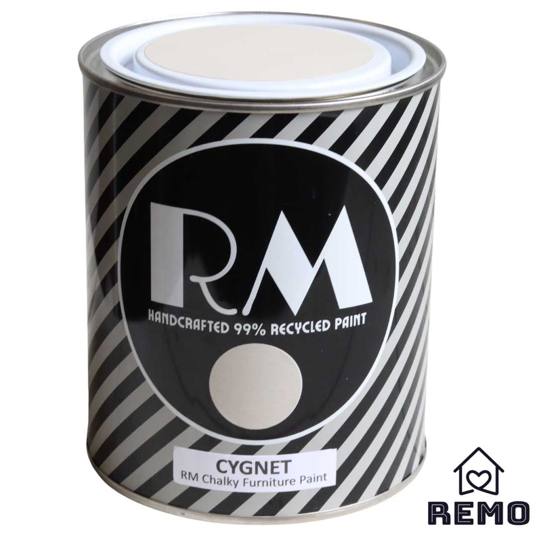 Front angle view of a black white and grey striped tin with round circle paint swatches in the colour Cygnet which is a similar colour to a baby swan